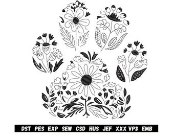 Könnte beinhalten: Schwarz-weißes florales Pfotenabdruck-Design. Der Pfotenabdruck besteht aus verschiedenen Blumen und Blättern. Das Bild enthält unten den Text "DST PES EXP SEW CSD HUS JEF XXX VP3 EMB".