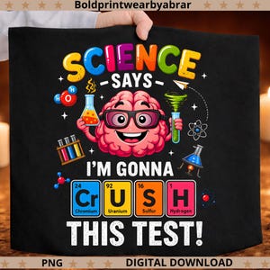 May include: Black graphic tee with the text "SCIENCE SAYS - I'M GONNA CRUSH THIS TEST!" featuring a cartoon brain wearing glasses and holding lab equipment. The design includes colourful science-themed elements and periodic table symbols.