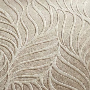 May include: Close-up of a beige textile with a raised, leaf-like pattern. The design features flowing, curved lines and textured details, creating a natural, organic aesthetic. The neutral color palette makes it versatile for various home decor applications.