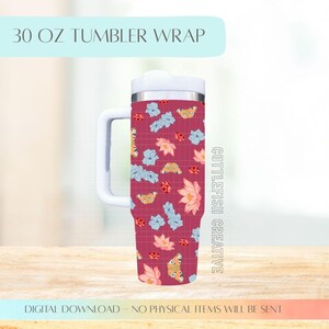 May include: A 30 oz tumbler wrap with a floral and butterfly pattern in shades of pink, blue, and orange. The tumbler has a white handle and lid. The text "30 OZ TUMBLER WRAP" is at the top. The words "CUTTLEFISH CREATIVE" are on the side.