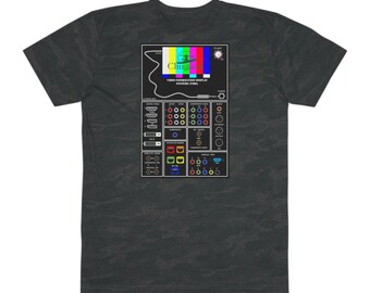 May include: Dark gray t-shirt featuring a graphic of a video display with the text "Chuggie" and "Video Termination Display System (1980)". The graphic includes a color test pattern and various connection ports.