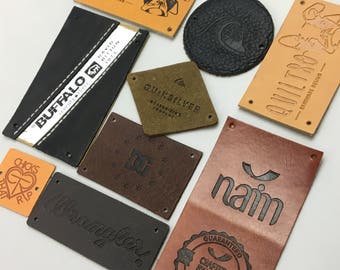 May include: Assortment of leather patches with various logos and text, including "Quiltro", "Buffalo", "Wrangler", "Quiksilver", "naim", and "Chicks That Rip".