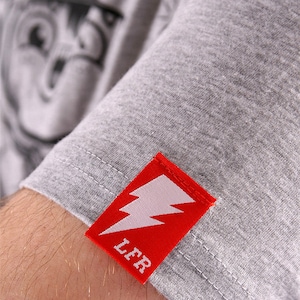 300 custom sleeve hem tags, custom hem tags, hem tags on t-shirt sleeves, pip tag woven label, pip woven tags