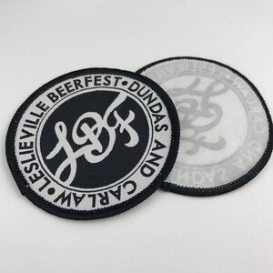 May include: Black and white embroidered patch with the text "Carlaw and Dundas Beerfest" and a stylized "L&D" logo.