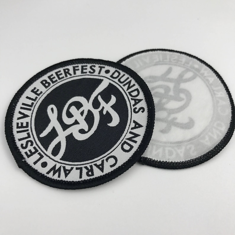 May include: Black and white embroidered patch with the text "Carlaw and Dundas Beerfest" and a stylized "L&D" logo.