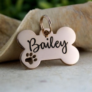 Personalized Rose Gold Dog ID Tag: Bone Shape with Paw Print cutout