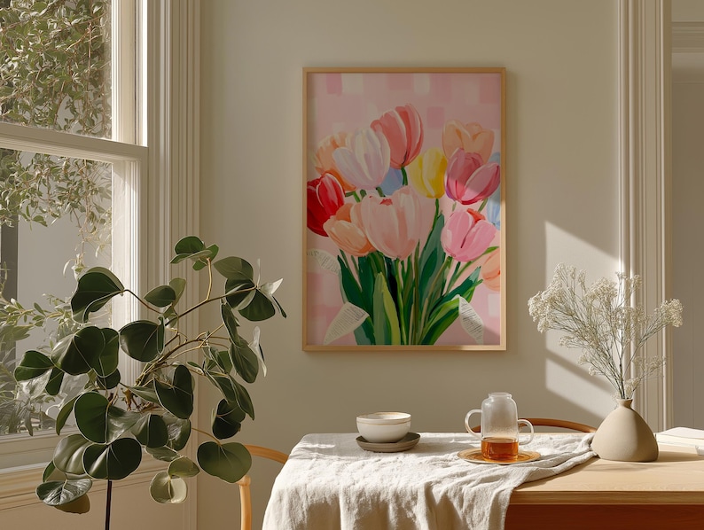 A colorful floral painting featuring a bouquet of tulips in shades of red, pink, orange, yellow, and purple. The artwork is set against a pink background.