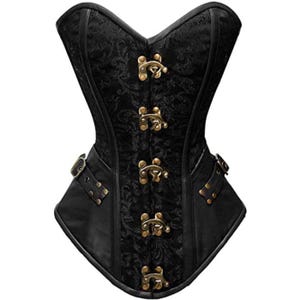 May include: Black corset with a floral pattern and bronze-coloured clasps. The corset features a structured bodice with a decorative design, leather panels, and buckle details. A stylish garment for special occasions.