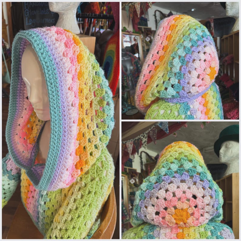 May include: A colorful, crocheted hood in a rainbow of pastel colors, including pink, yellow, green, and blue. The hood is displayed on a mannequin head, showcasing its design and texture. The crochet pattern is open, creating a breathable and stylish accessory.