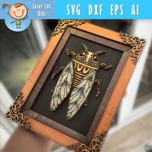May include: Wooden framed art piece featuring a detailed cicada design. The cicada has intricate patterns in shades of gold, brown, and blue. The frame is a light brown with decorative corner accents. The text "SVG DXF EPS AI" is visible.