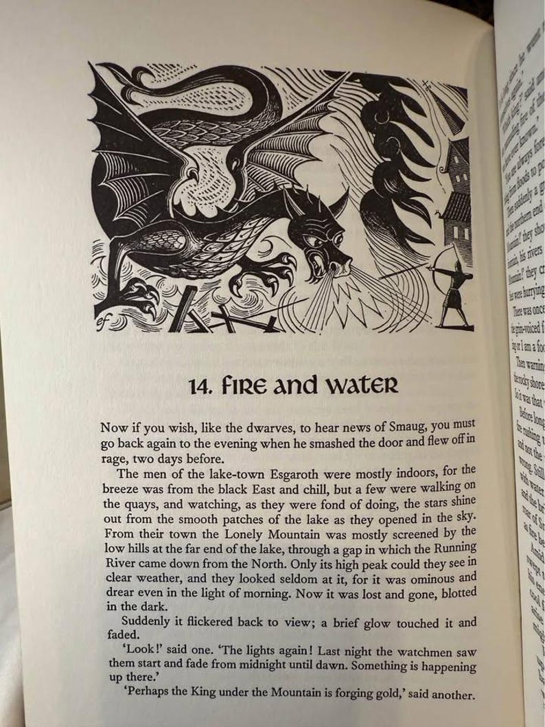 May include: Black and white illustration from a book depicting a dragon breathing fire at an archer. The dragon has large wings and a menacing expression. The text "14. FIRE AND WATER" is above the illustration.
