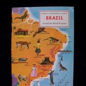 May include: A colorful map of Brazil with illustrations of animals, people, and landmarks. The map includes the text "American Geographical Society" and "Brazil Around the World Program".