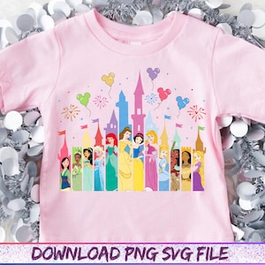 May include: A light pink t-shirt featuring a colorful graphic of Disney princesses standing in front of a castle. The design includes balloons and fireworks. The text "DOWNLOAD PNG SVG FILE" is at the bottom.