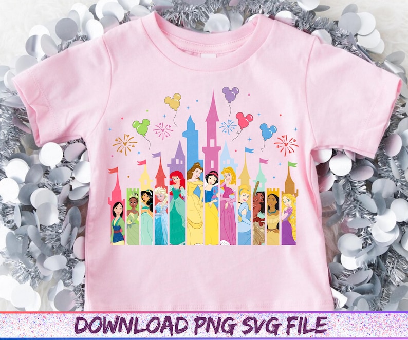 May include: A light pink t-shirt featuring a colorful graphic of Disney princesses standing in front of a castle. The design includes balloons and fireworks. The text "DOWNLOAD PNG SVG FILE" is at the bottom.
