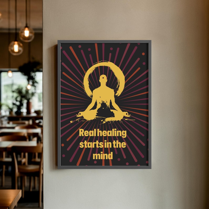 May include: Framed poster with a black border. The artwork features a gold silhouette of a person in a seated yoga pose, surrounded by a gold halo and red and gold rays on a black background. The text "Real healing starts in the mind" is below the figure.