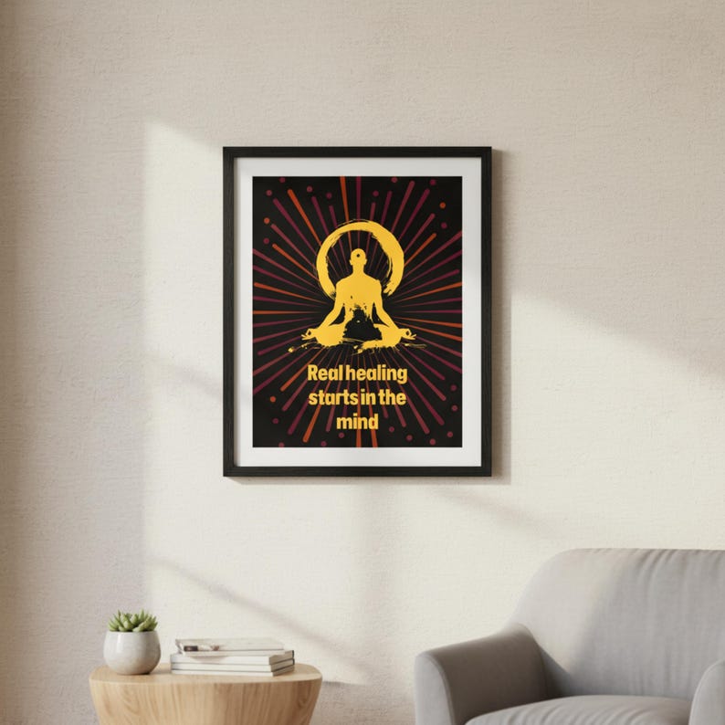 May include: A framed poster with a black border. The artwork features a yellow silhouette of a person in a yoga pose, surrounded by a radiating burst of red and yellow lines. Text reads "Real healing starts in the mind."