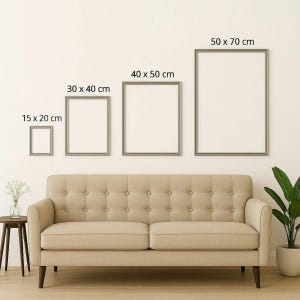 May include: Four framed art prints of varying sizes (15 x 20 cm, 30 x 40 cm, 40 x 50 cm, and 50 x 70 cm) are displayed above a beige sofa. The frames are silver and the prints are blank, ready for artwork.