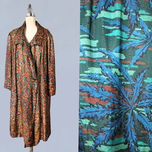 May include: A long, colorful, patterned coat with a double-breasted closure. The coat is made of a shiny fabric with a variety of colors, including red, orange, yellow, green, blue, and black.