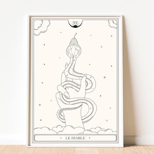 Puede incluir: Ilustración en blanco y negro enmarcada de una mano sosteniendo una serpiente. La serpiente se enrolla alrededor de la mano, con la cabeza de la serpiente en la parte superior de la imagen. El texto "LE DIABLE" está en la parte inferior.
