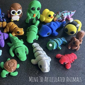 May include: A collection of colorful, mini 3D articulated animal figurines. The assortment includes an octopus, alligator, turtle, and other creatures in various colors. The text "MINI 3D ARTICULATED ANIMALS" is at the bottom.