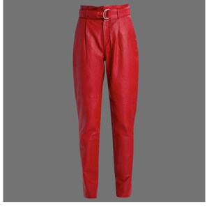 May include: Bright red leather pants with a high waist and a belt with a silver buckle. The pants have a tailored fit with pleats at the waist and a tapered leg. The leather appears smooth and shiny.