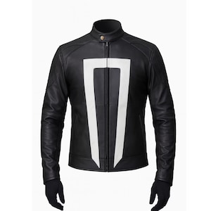 May include: Black leather jacket with a white graphic design on the front. The jacket has a stand-up collar, a zipper closure, and long sleeves. The jacket is shown with black gloves.