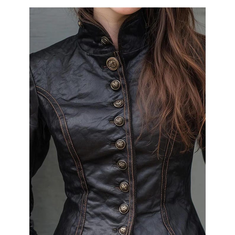 May include: A black, textured jacket with a high collar and decorative buttons. The jacket features a row of ornate buttons down the front and contrasting stitching. The style is reminiscent of vintage or steampunk fashion.