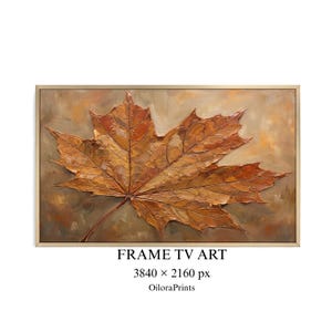 May include: A rectangular wall art print featuring an oil painting of a single large maple leaf in shades of brown, orange, and gold. The leaf has visible impasto brushstrokes and is set against a muted, earthy background, enclosed in a thin frame.
