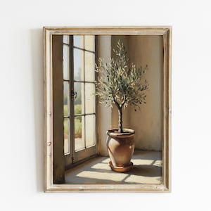 Peut inclure: Peinture encadrée d'un olivier en pot de terre cuite près d'une fenêtre. L'œuvre présente un éclairage doux et une palette de couleurs sourdes, avec les feuilles de l'arbre et les détails du pot clairement visibles. La peinture évoque la sérénité.