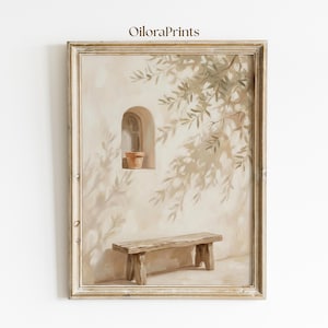 May include: A framed art print showing a tranquil outdoor scene. A rustic wooden bench is beneath a wall with an arched window and a small terracotta pot. Olive tree branches cast shadows. The artwork is signed "Oiloraprints".