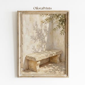 May include: A framed wall art print titled OiloraPrints featuring an oil painting of a stone bench set against a textured beige wall. The scene includes the shadow of an olive tree branch cast across the wall and the bench in neutral tones.