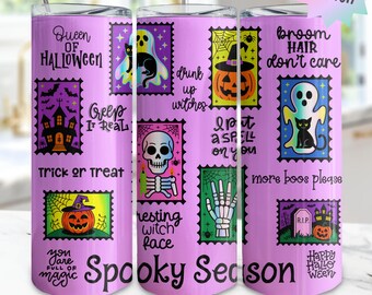 May include: Three pink Halloween-themed tumblers with various designs. Each tumbler features stamp-like graphics with spooky images like ghosts, pumpkins, and skulls. Text includes "Queen of Halloween," "Spooky Season," and "Trick or Treat."