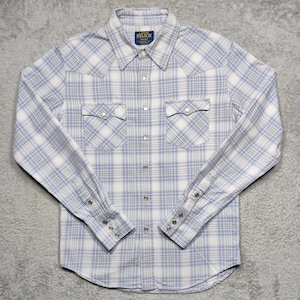 May include: A light blue and white plaid button-down shirt with long sleeves. The shirt has two chest pockets and a collar. The brand name "NELSON" is on a small tag at the collar.