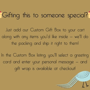 Gold background Image with gift icons that says "Gifting this to someone special? Just add our Custom Gift Box to your cart along with any items you'd like inside - we'll do the packing and ship it right to them! In the Custom Box listing, you'll select a greeting card and enter your personal message. Gift wrap is available at checkout!"  with a blue peacock bird in the corner.