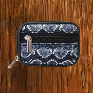 Black Snakeskin travel pill organizer case closed, compact zippered medication pouch for daily use, portable storage for vitamins and prescriptions.