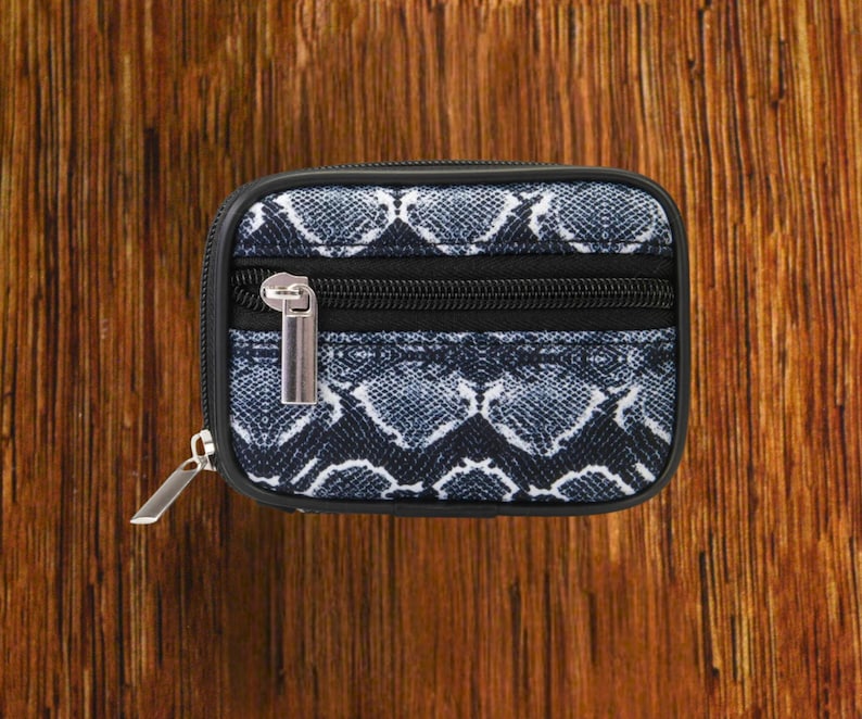 Black Snakeskin travel pill organizer case closed, compact zippered medication pouch for daily use, portable storage for vitamins and prescriptions.