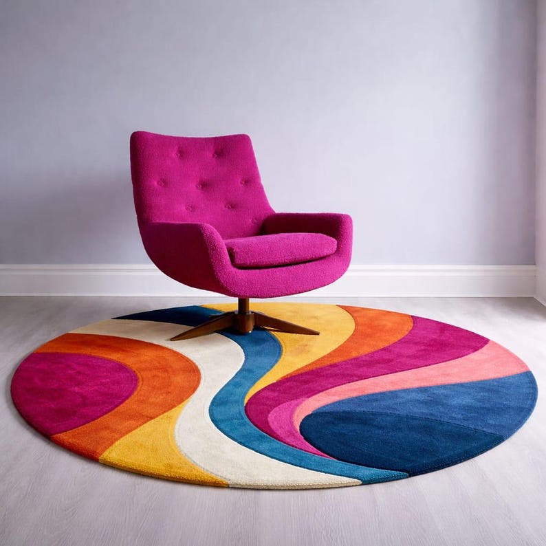 May include: A vibrant, round area rug with a retro design featuring wavy stripes in shades of blue, pink, orange, yellow, and white. A magenta swivel chair with a wooden base sits above the rug, creating a colorful and stylish interior design.