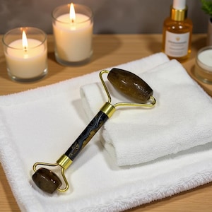 tiger’s eye face roller with gold plated frame dual ended gemstone facial massager for skincare routine