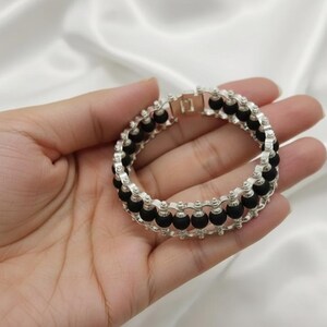 Handcrafted natural black Karungali wood bracelet offering a classic look with spiritual and protective significance.