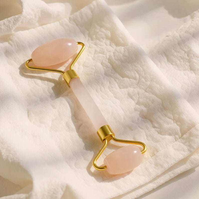 Rose quartz facial roller with gold frame dual head crystal face massager for skincare routine
