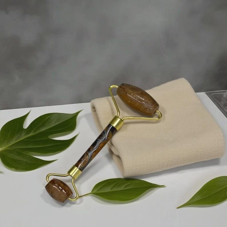 gemstone facial roller tiger eye for puffiness look and relaxing massage routine