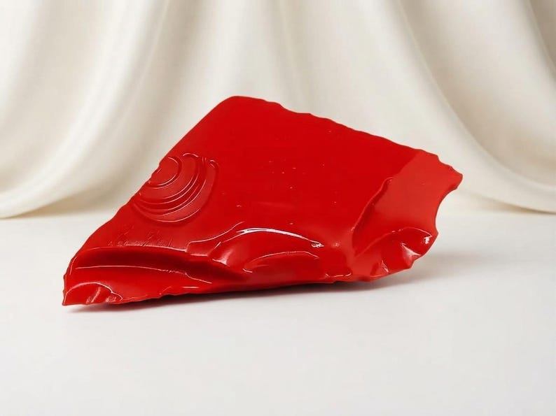 Natural red coral rough in an irregular uncut form for lapidary inlay, artisan jewelry crafting and collector display.