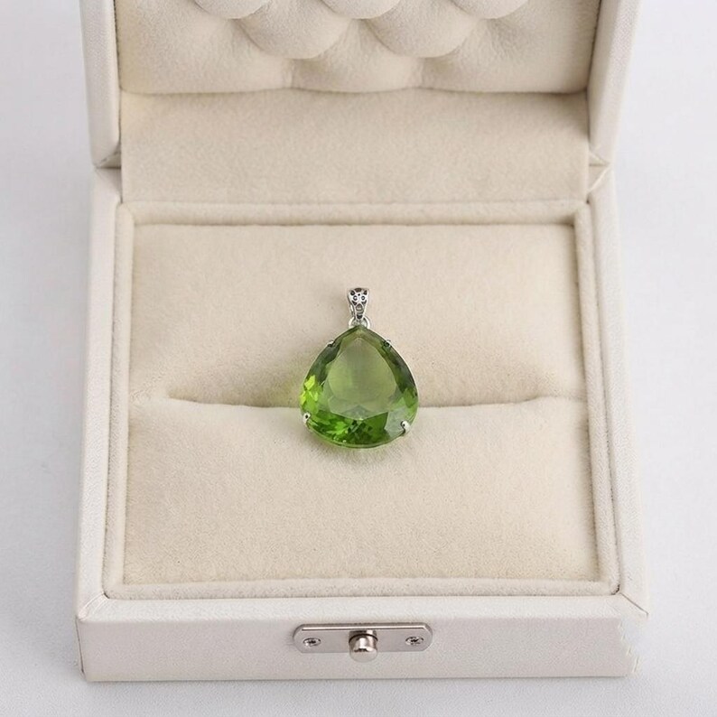 Oversized green emerald teardrop pendant in 4-prong silver setting, spiritual crystal jewelry for love and harmony