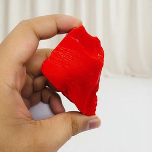 Large 1350ct red coral rough specimen showing vivid coloring and raw unpolished form for jewelry-making material.