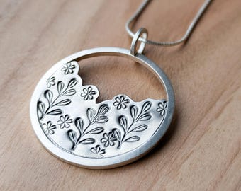 Sterling silver botanical cut out disc necklace, hand stamped leaf and daisy hoop pendant on an 18&quot; chain, luxury Christmas gift for her
