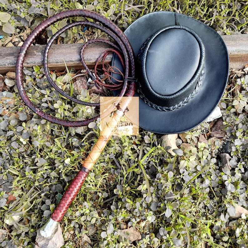 Handheld image showing grip and length of leather bullwhip
