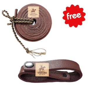 May include: A rolled brown leather rein with a knotted rope and a matching leather strap with a silver snap. The products have the "Vaquero Spirit" logo. The items are for equestrian use.