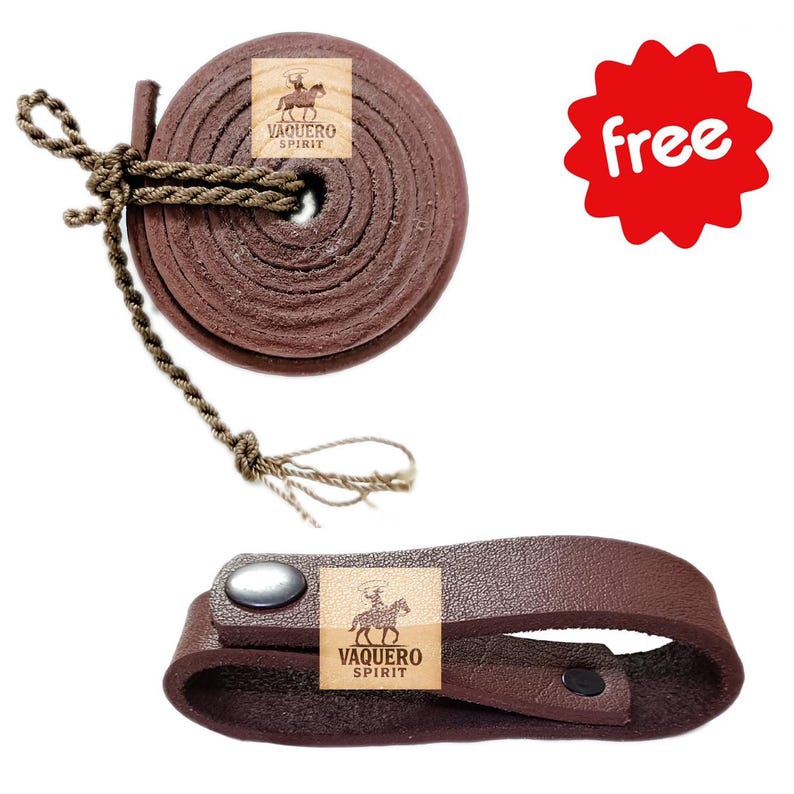 May include: A rolled brown leather rein with a knotted rope and a matching leather strap with a silver snap. The products have the "Vaquero Spirit" logo. The items are for equestrian use.