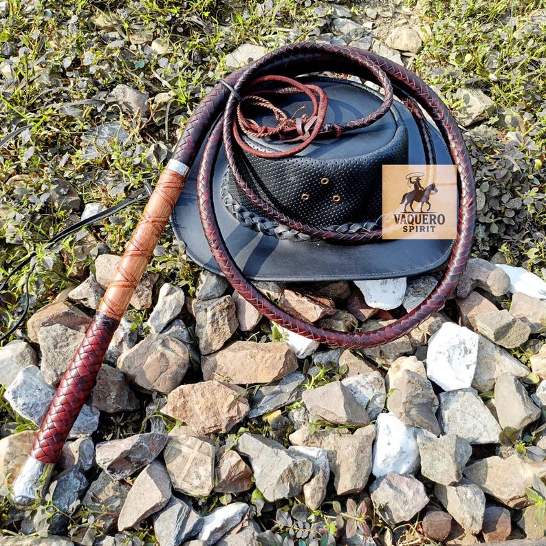 Side view of full-length leather bullwhip in dark brown color