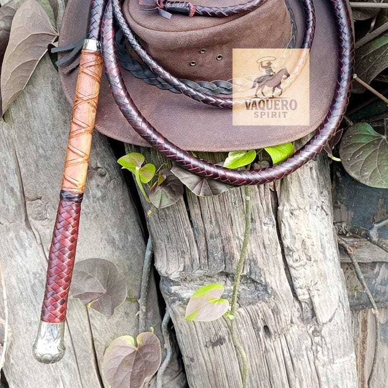 Long polished wooden handle of handcrafted bullwhip